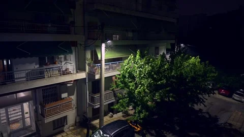 Tranquility of a rainy night in the city. Highlighting a residential building Stock Footage 280681173