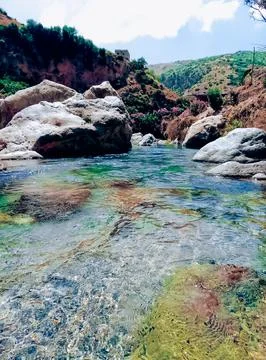 Tranquility of a slow flowing valley stream in the Heart of nature soothing Stock Photos