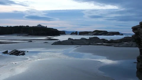 The tranquility of sunset in Os Castros beach Stock Footage 303310099