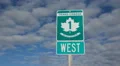 Trans Canada Highway 1 sign in Saskatchewan, Canada. Time lapse clouds. HD Footage