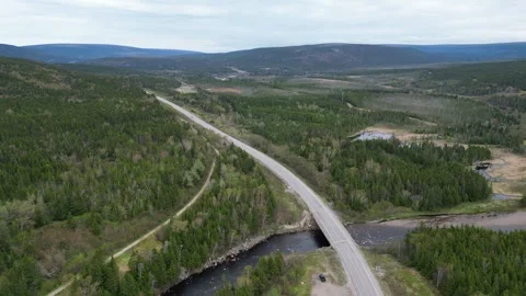 Trans-Canada Highway as it snakes through Newfoundland's vast wilderness Stock Footage 253473985