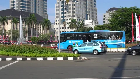 Trans Jakarta Moving Through Thamrin fountain Intersection Stock Footage 204845722