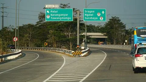 Trans Java toll road at noon. There are signs for the city of Tawangmangu, .. Stock Photos
