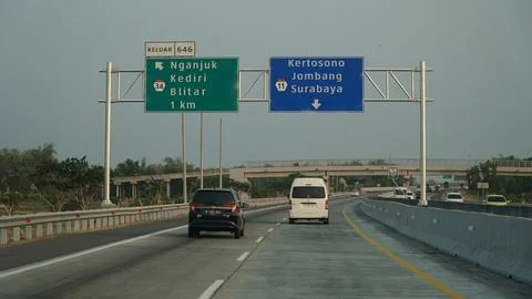 Trans Java toll road. There is a sign in the direction of Nganjuk, Kediri, .. Stock Photos