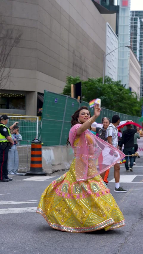Trans Pride Performer Dancing in Traditional Outfit at Toronto Parade 스톡 동영상 332018059