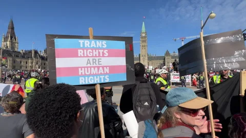 Trans rights activists clash with conservatives in front of Parliament Hill Stock Footage 254821230