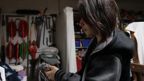 Trans teen doing laundry Stock Footage 79047609