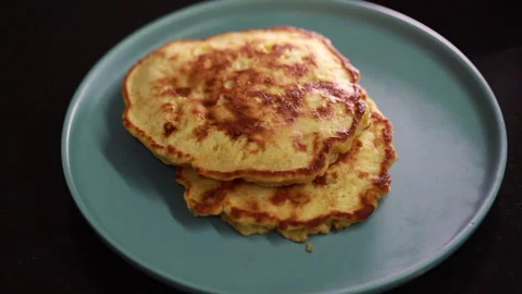 Transfer the cooked pancakes to a serving plate Stock Footage 160119005