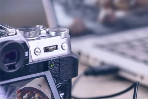 Transfer photos from camera to computer via cable. Stock Photos