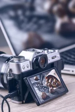 Transfer photos from camera to computer via cable. Stock Photos