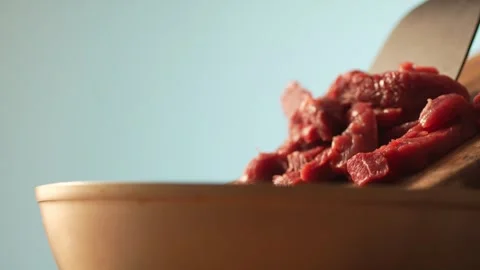 Transferring Beef Strips to Frying Pan. Stock Footage 258622735