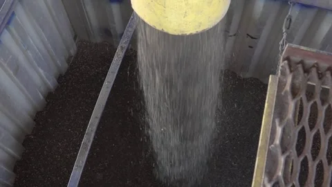 Transferring bulk materials within an industrial container effectively and Stock Footage 310315747