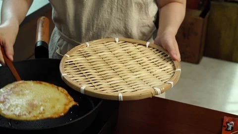 Transferring Crispy Korean Potato Pancake to Strainer Basket Stock Footage 334160150