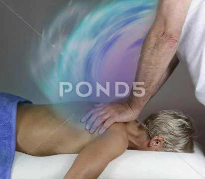 Transferring energy during healing massage Stock Photos