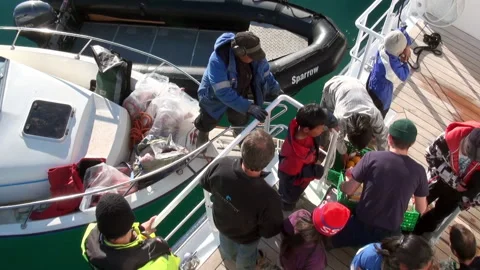 Transferring Fresh Fruit to Expedition Ship in Iceland's Waters Stockbeeldmateriaal 321064122