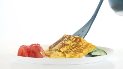Transferring an omelette to a dish Stock Footage 89426638