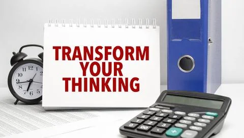 TRANSFORM YOUR THINKING words on white notebook and calculator, black vinta.. Stock Photos
