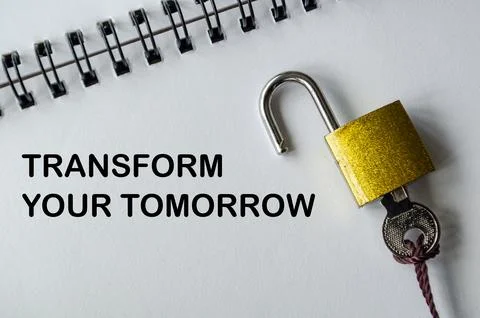 TRANSFORM YOUR TOMORROW, Inspirational notepad with padlock and key symboli.. Stock Photos