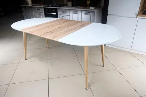 Transformer table. Extendable dining table set. Wood kitchen and dining room Stock Photos