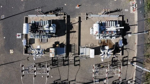 Transformers at a power electrical sub station from above Stock Footage 107177319
