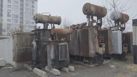 Transformers at power station, cut by shrapnel from shells and drones, Ukraine Stock Footage 300215524