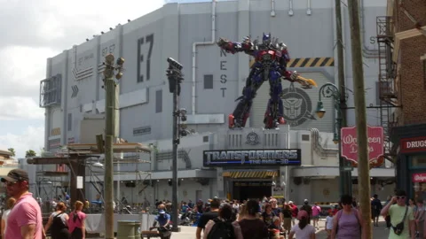 Transformers Ride at Universal Studios Florida with Crowds on Busy Theme Park Stock Footage 336562264