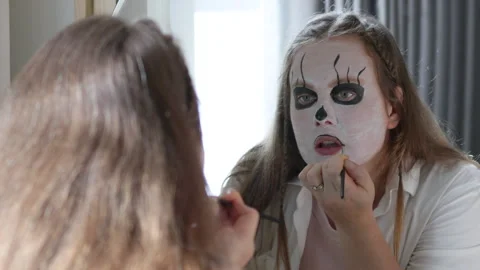 Transforming into spooky skeleton for Halloween. Stock Footage 290487958