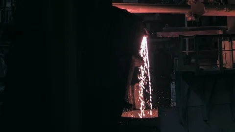 Transfusion of liquid metal from one container to another Stock Footage 90565206
