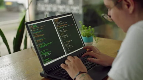 Transgender developer programs in coworking space. Inclusive tech pro codes on Stock Footage 264481327