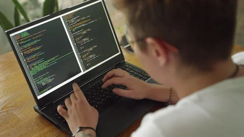 Transgender developer programs in modern coworking space. Inclusive work Stock Footage 264479722