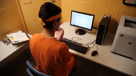 Transgender woman inmate using computer at Cibola County Detention Center Stock Footage 109790800