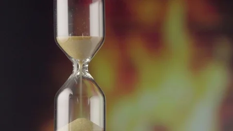 The transience of time. Hourglass on a colored background close-up Stock Footage 121559778