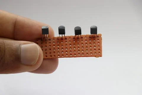 Transistor connected to an empty PCB or the copper plated empty pcb Stock Photos