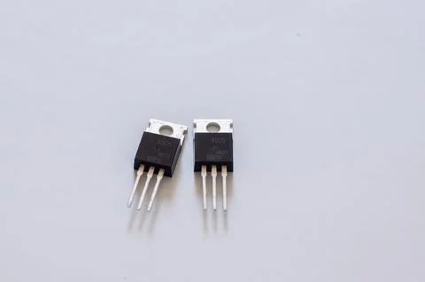 Transistor mounted on a breadboard with a white background. Stock Photos