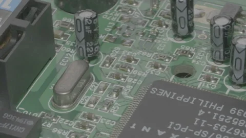 Transistors and chip on computer board slowly rotating Stock Footage 264549684