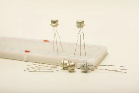 Transistors in a metal casing. Semiconductor components on a breadboard. Stock Photos