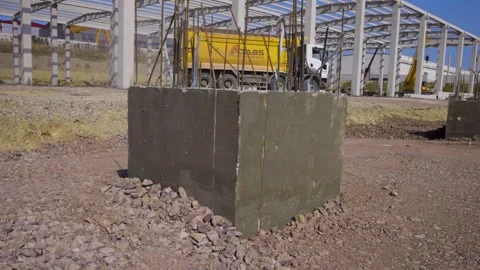 Transit Truck Passes by Under-Construction Warehouse Stock Footage 287644996