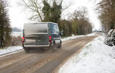 Transit van driving in snow Stock Photos