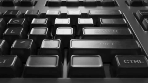Transition close-up of a computer keyboard. Camera movement along the keyboard. Stockbeeldmateriaal 314747536