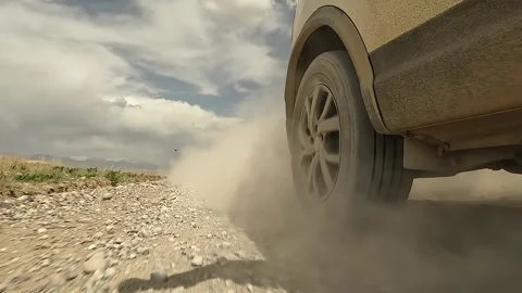 The transition from the front right wheel of the car to the rear Stock Footage 241380692