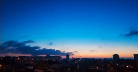 Transition from night to dawn against the backdrop of the cityscape Stock-Footage 74541001