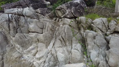 A transition from rocks covered to the deep blue sky covered with clouds. Stock Footage 279249042