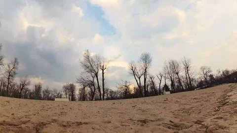 The transition from a sandy beach to a blue sky with large clouds Stock Footage 105460043