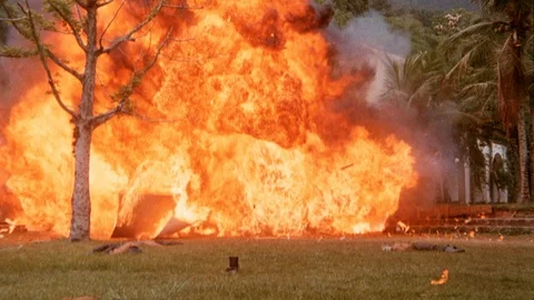 Transition shot of houses exploding into flames, 1980s Stock Footage 90727968