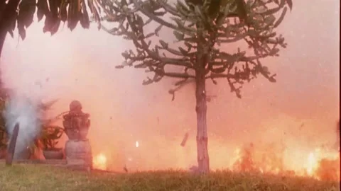 Transition shot of houses exploding into flames, 1980s Stock Footage 260258588
