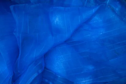 Translucent blue net fabric can be used as a background wallpaper Stock Photos