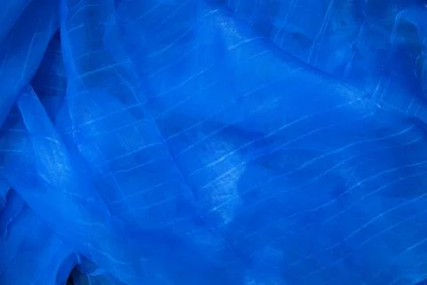 Translucent blue net fabric can be used as a background wallpaper Stock Photos