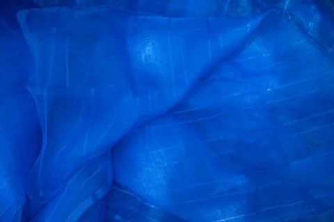 Translucent blue net fabric can be used as a background wallpaper Stock Photos