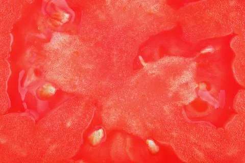 Translucent cross-section of tomato, macrobackground Foto stock