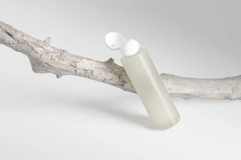 Translucent cylindrical cosmetic bottle with ball shape flip cap mockup Stock Illustration